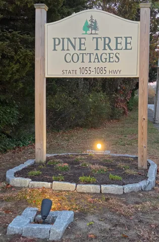 a sign board with a yard