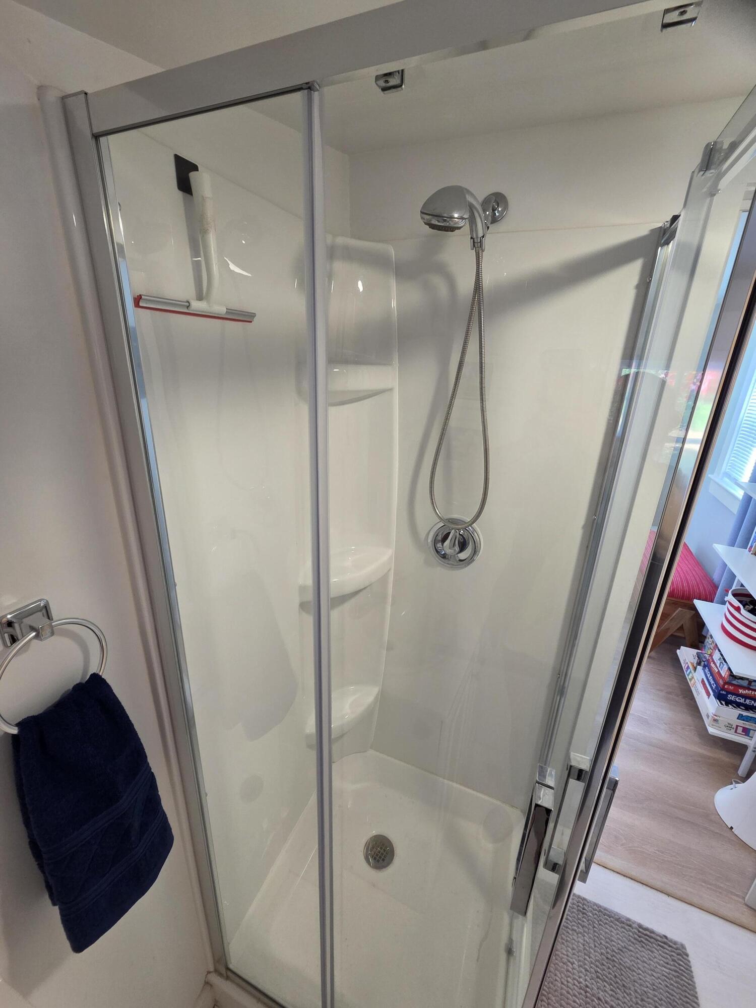 1061 State Highway, Unit 4 Eastham, MA 02642 - Photo 10 of 27 a bathroom with a glass shower door