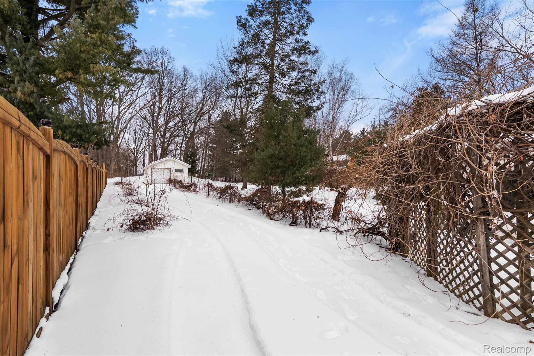 7192 Torrey Road Swartz Creek, MI 48473 - Photo 22 of 27 Yard layered in snow featuring an outdoor structure