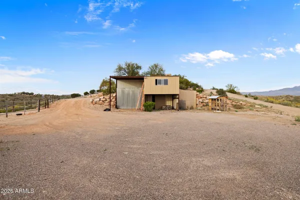 a kitchen with granite countertop a sink and a window