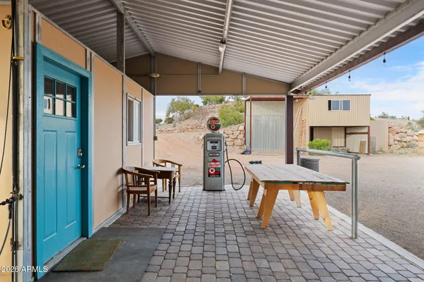 a bedroom with a bed and a large mirror