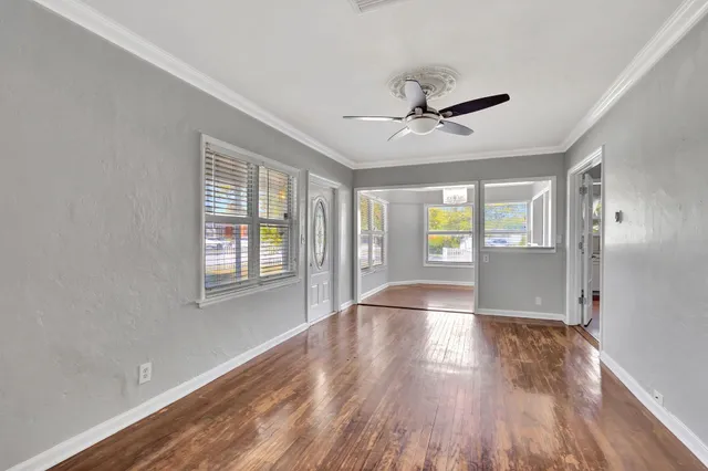 a view of a room with wooden floor