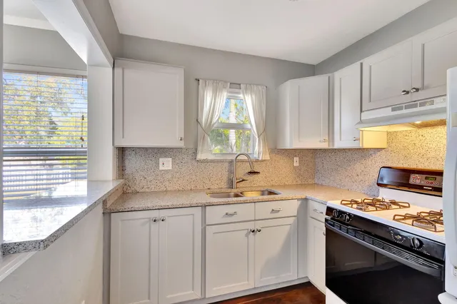 a kitchen with a stove and a refrigerator