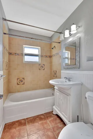 a view of an empty room and wooden floor