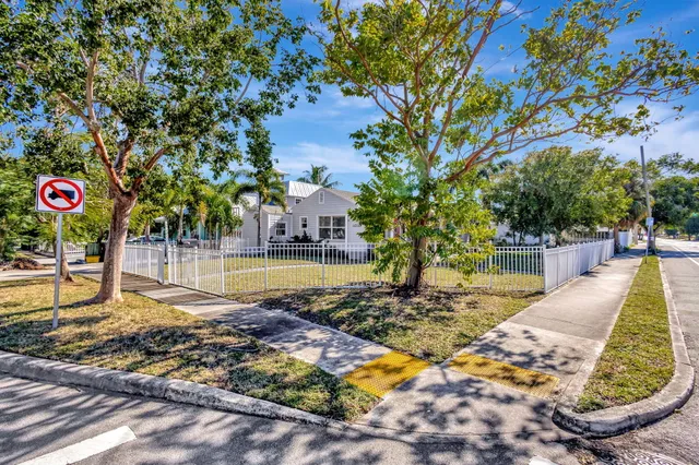 a view of a wrought iron fences in front of house