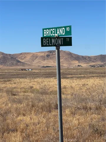 a sign broad in the middle of a city