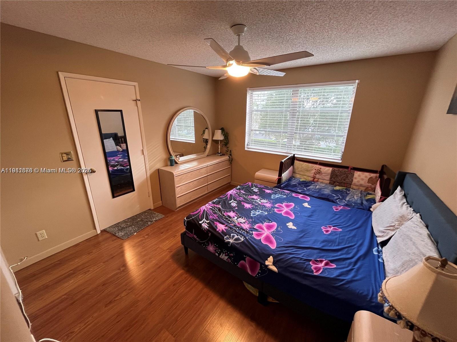 2230 North Cypress Bend Drive, Unit 309 Pompano Beach, FL 33069 - Photo 11 of 31 a bed room with a bed