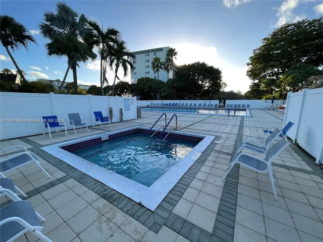 a view of a backyard and a barbeque