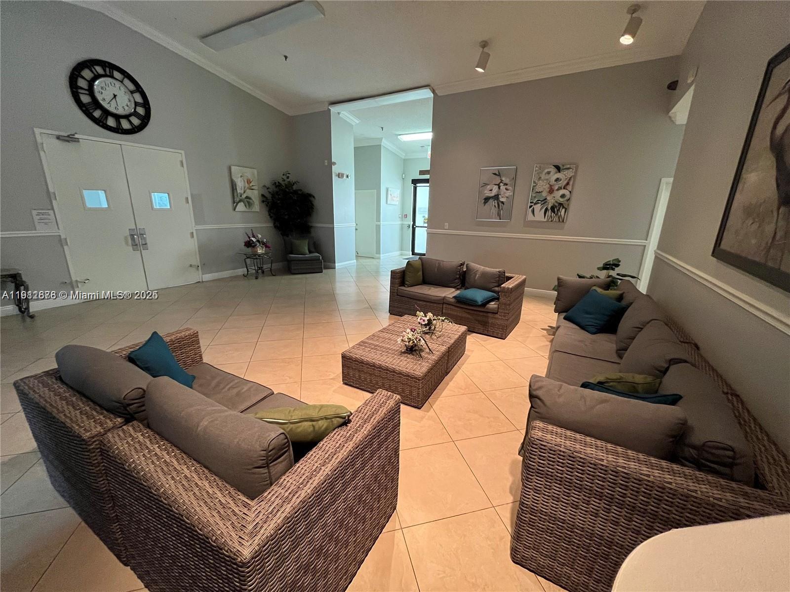 2230 North Cypress Bend Drive, Unit 309 Pompano Beach, FL 33069 - Photo 25 of 31 a living room with furniture