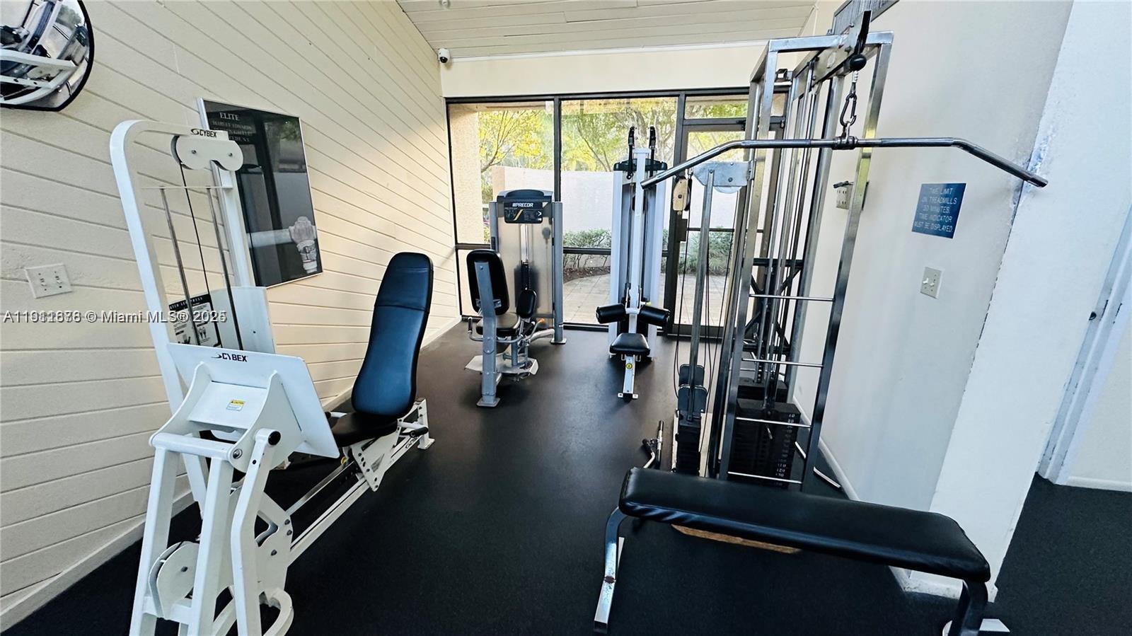 2230 North Cypress Bend Drive, Unit 309 Pompano Beach, FL 33069 - Photo 30 of 31 a view of a room with gym equipment