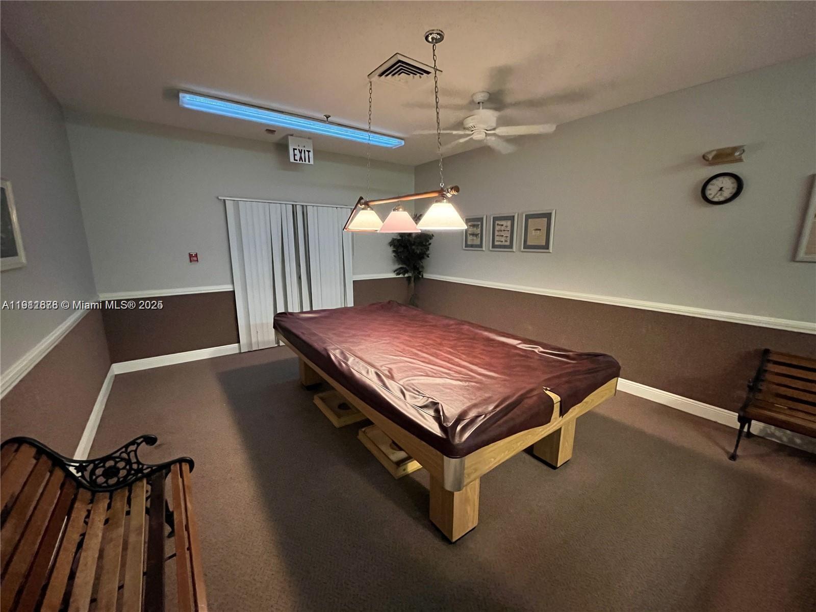 2230 North Cypress Bend Drive, Unit 309 Pompano Beach, FL 33069 - Photo 31 of 31 a room with pool table and windows