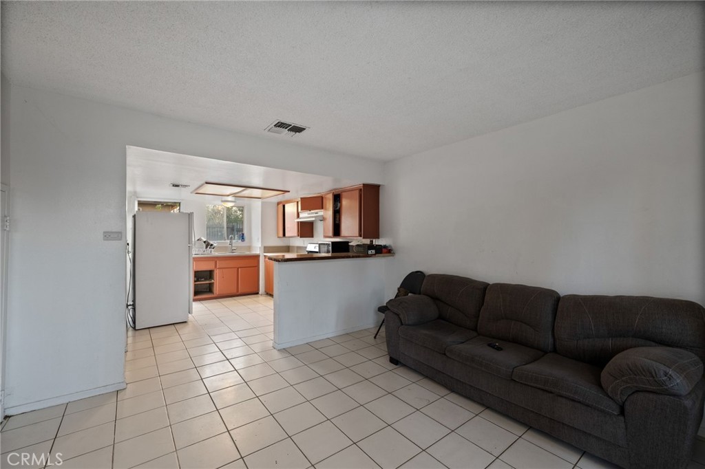 715 N Street Bakersfield, CA 93304 - Photo 7 of 7 a living room with furniture and kitchen view