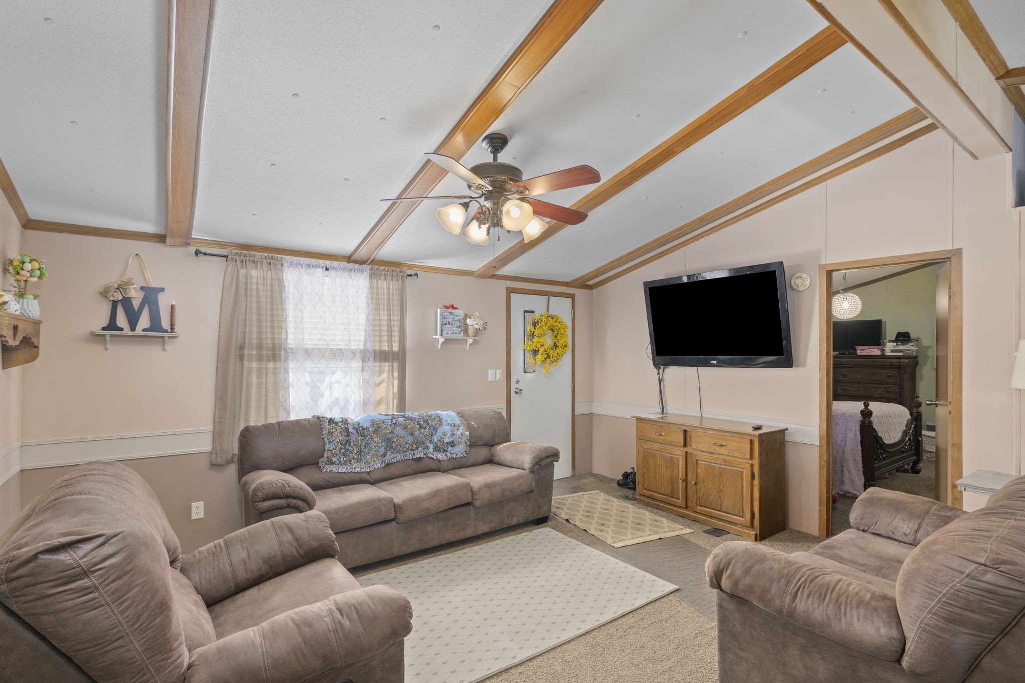 260 Ragland Road Cottontown, TN 37048 - Photo 19 of 36 a living room with furniture and a flat screen tv