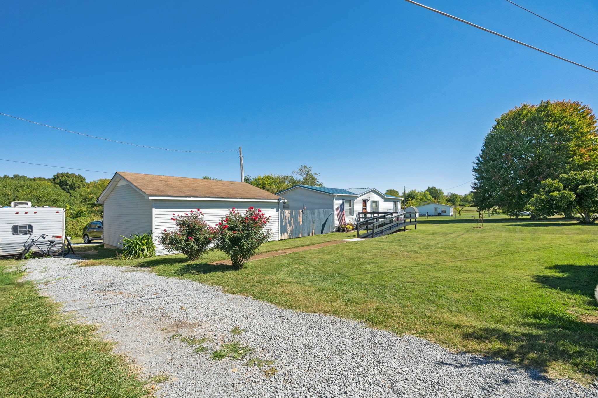 260 Ragland Road Cottontown, TN 37048 - Photo 6 of 36 a front view of a house with a yard and lake view