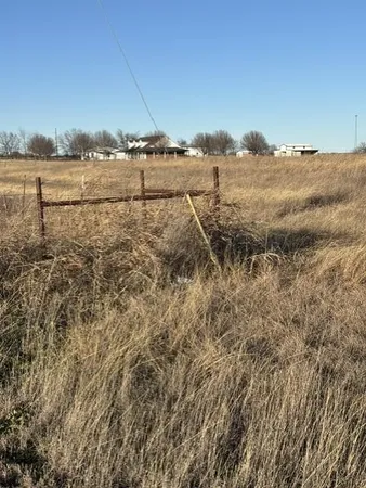 a view of a lake with houses in the back