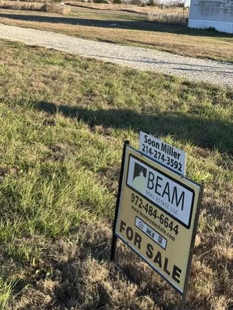 a view of a large body of water with a building in the background