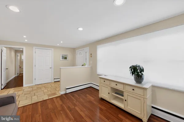 a view of an empty room and wooden floor