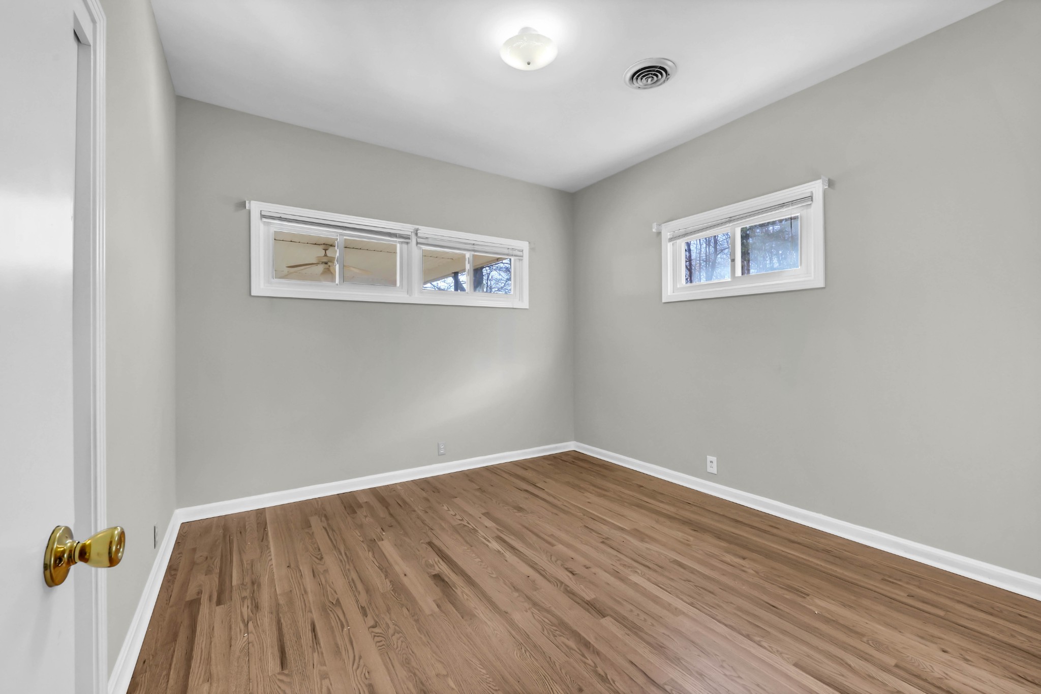 780 Rossview Road Clarksville, TN 37043 - Photo 17 of 40 a view of a room with wooden floor and wall painting