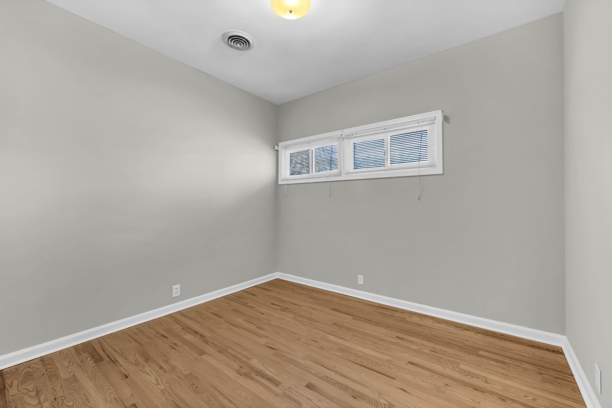 780 Rossview Road Clarksville, TN 37043 - Photo 23 of 40 a view of an empty room with wooden floor