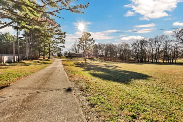 a view of a swimming pool with an outdoor space and seating area
