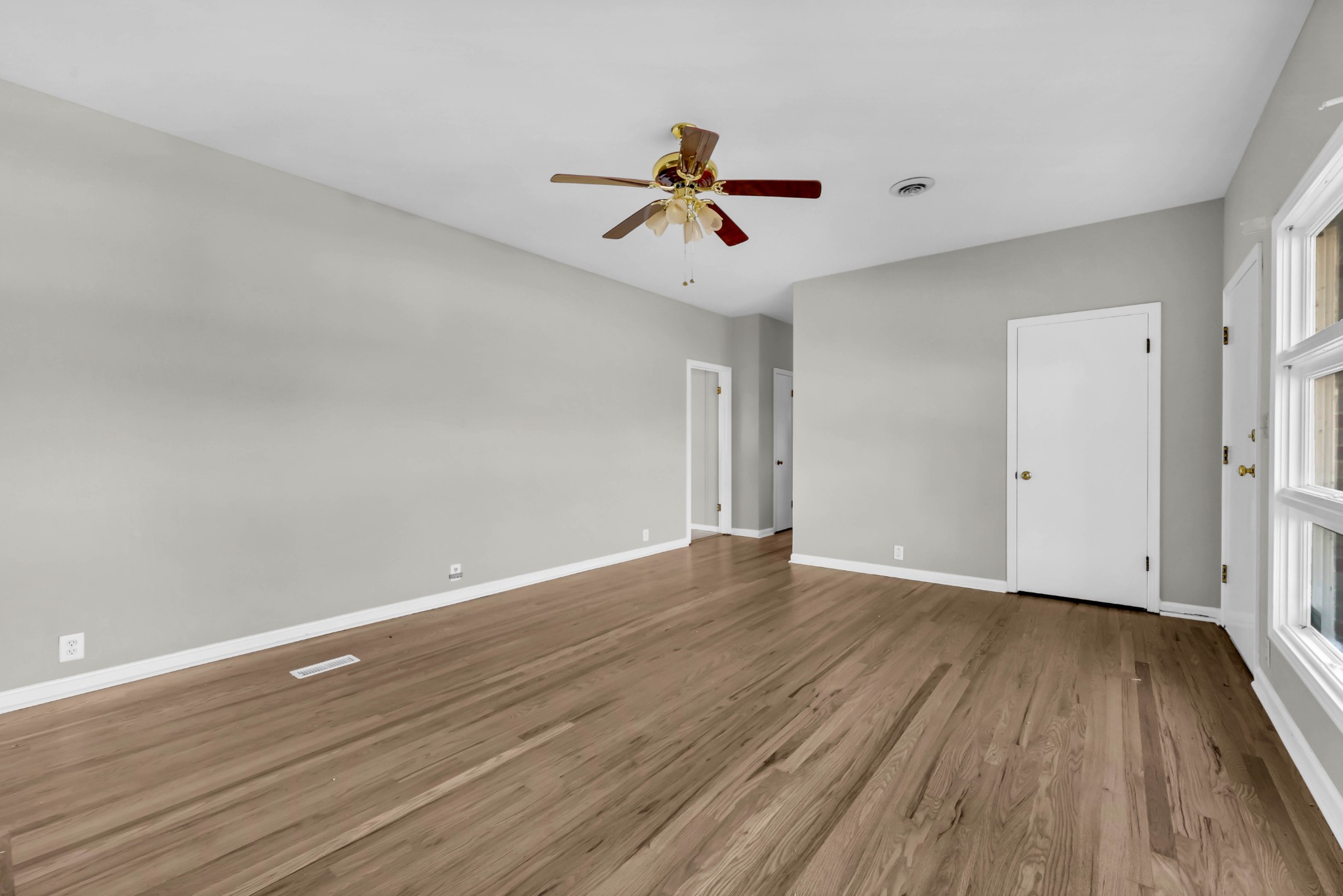 780 Rossview Road Clarksville, TN 37043 - Photo 9 of 40 wooden floor in an empty room with a window