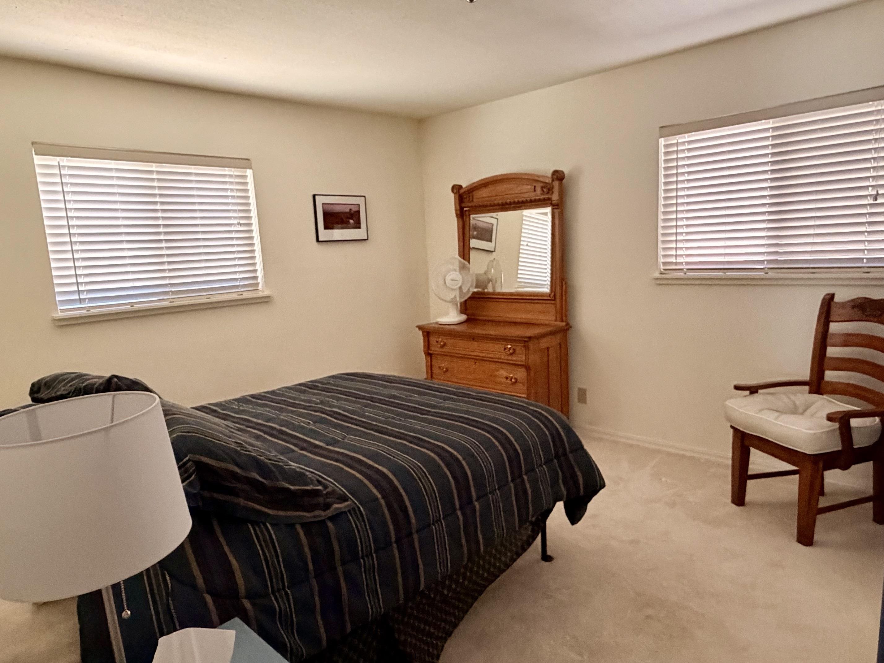 201 Poplar Valley Road Blairsden, CA 96103 - Photo 7 of 19 a bedroom with a bed a window and chair