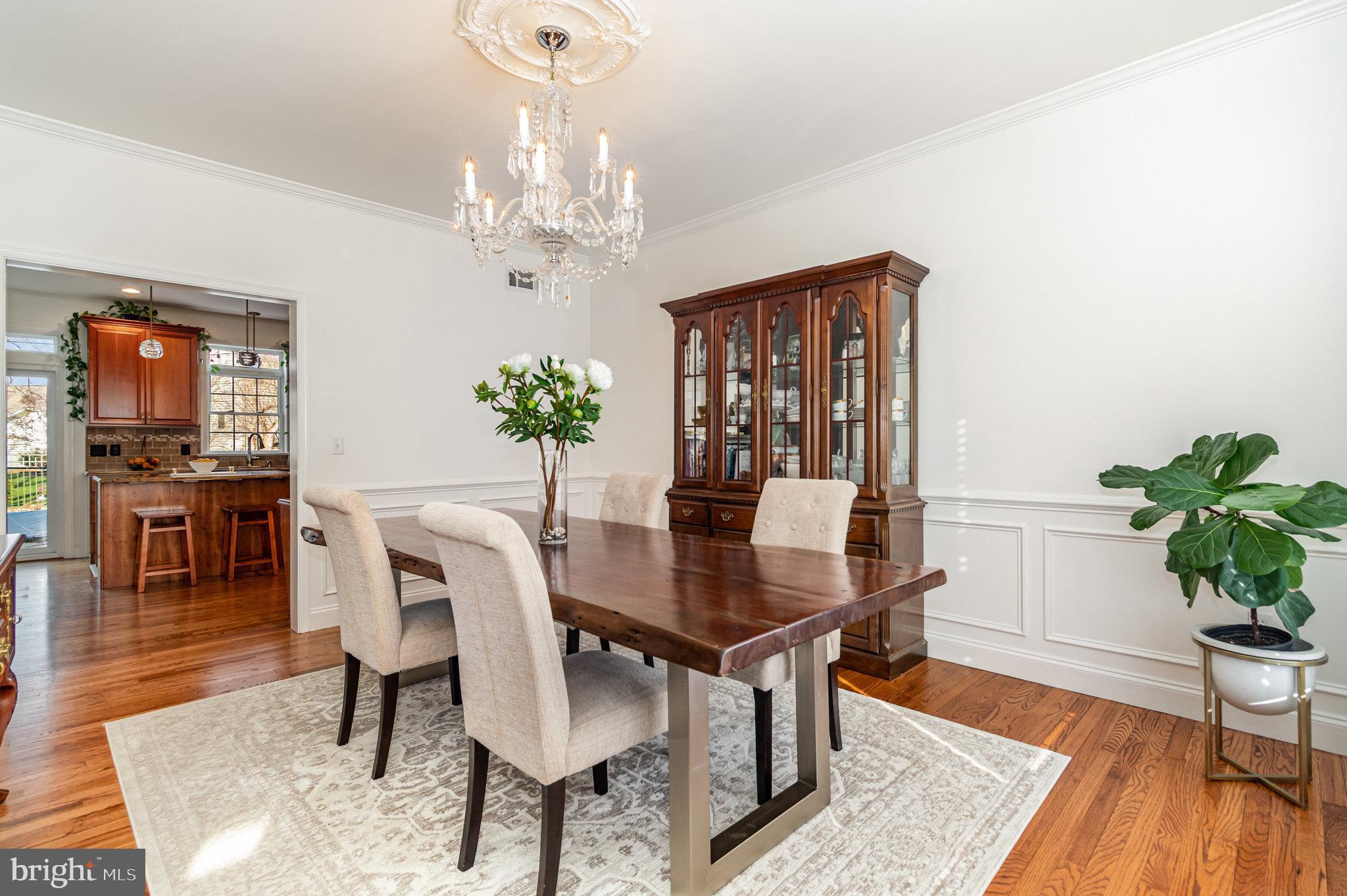 123 Glebe Lane Lancaster, PA 17602 - Photo 12 of 57 a view of a dining room with furniture wooden floor and chandelier
