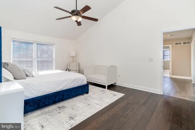 an aerial view of a house with a yard and lake view