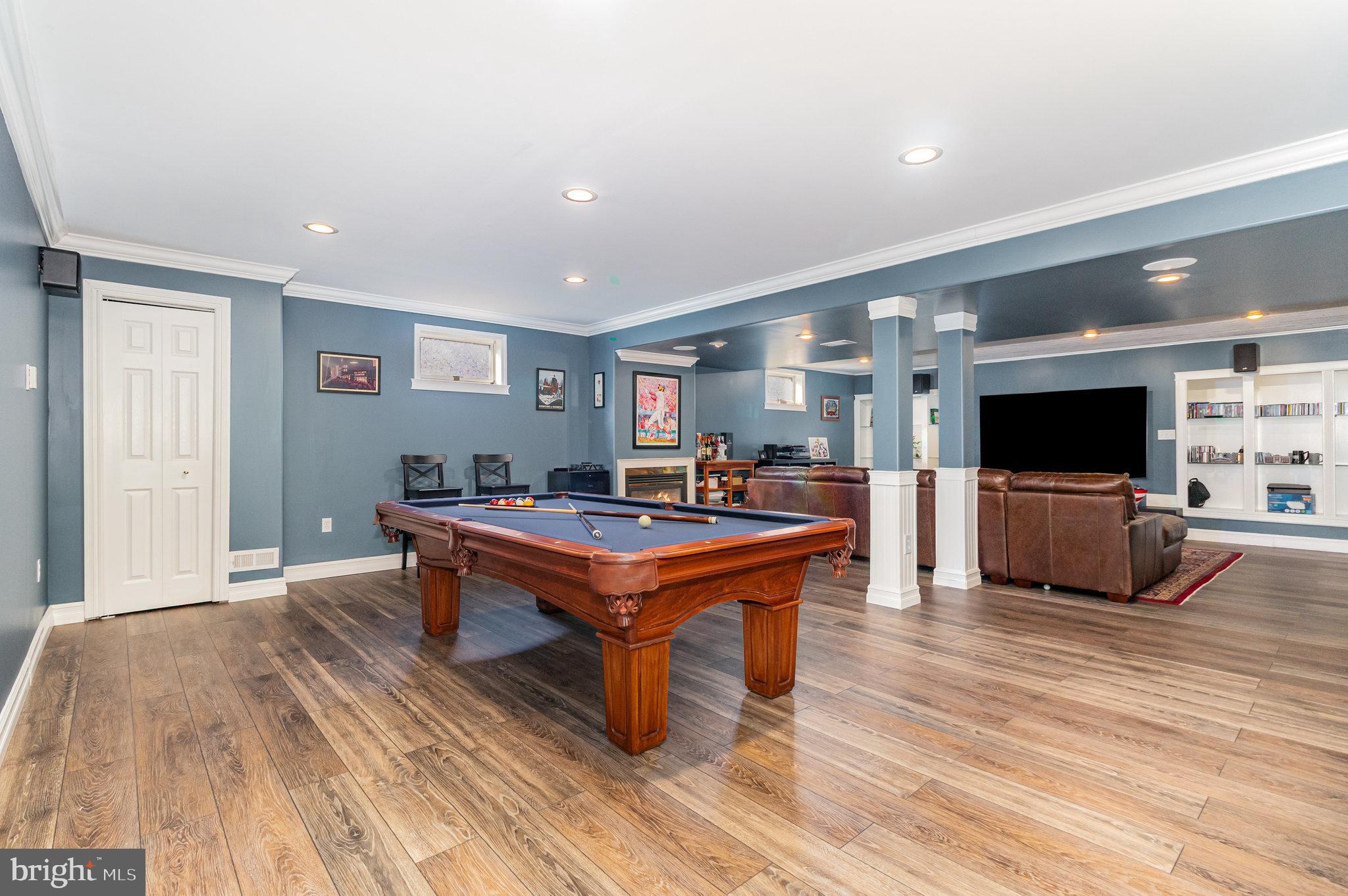 123 Glebe Lane Lancaster, PA 17602 - Photo 38 of 57 a living room with furniture a flat screen tv and kitchen view