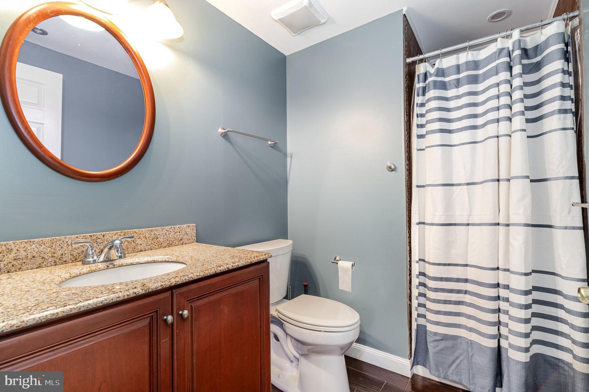 123 Glebe Lane Lancaster, PA 17602 - Photo 40 of 57 a bathroom with a sink a toilet and a mirror