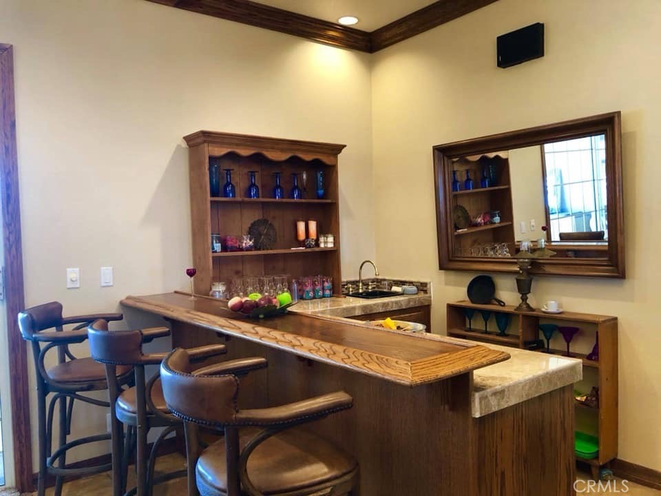 9126 Kittering Road Oak Hills, CA 92344 - Photo 13 of 47 bar in family area