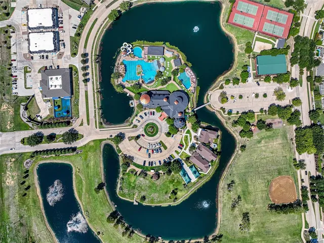 an aerial view of a golf course with swimming pool