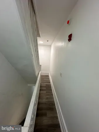 a view of a hallway with stairs