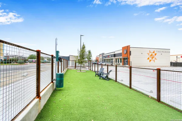 a wooden bench sitting in front of a building