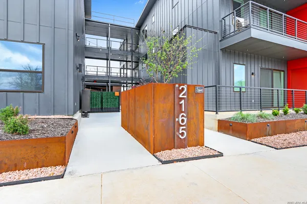 a front view of building with street