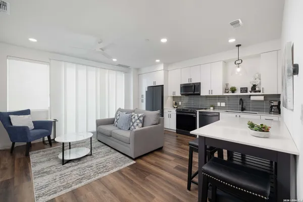 a kitchen with a sink and a refrigerator