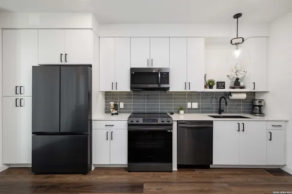 a kitchen with a stove and a microwave