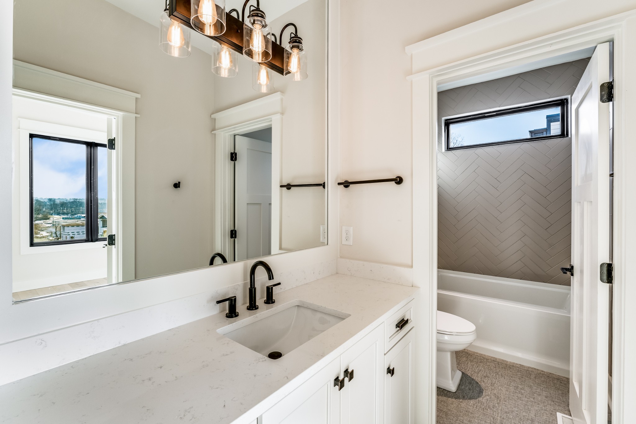 12 Shepard Street Nashville, TN 37210 - Photo 17 of 23 a bathroom with a tub sink and mirror