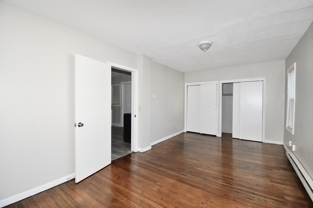30 Sachem Street Springfield, MA 01108 - Photo 13 of 22 a view of an empty room with wooden floor