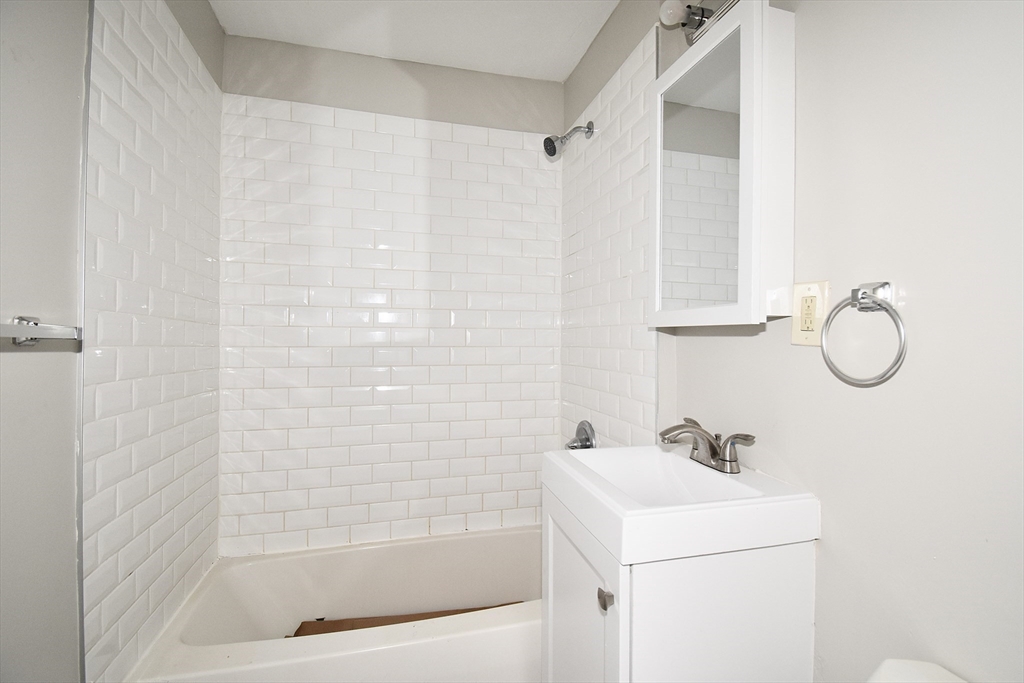 30 Sachem Street Springfield, MA 01108 - Photo 19 of 22 a bathroom with a sink a toilet and shower