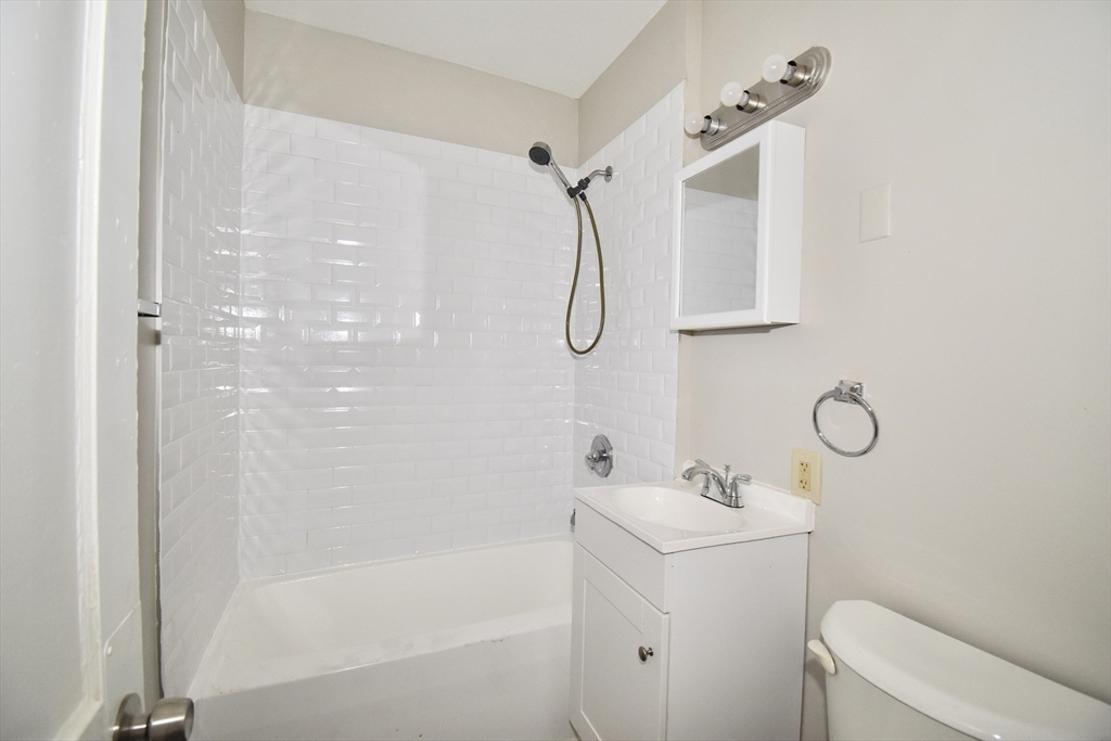 30 Sachem Street Springfield, MA 01108 - Photo 10 of 22 a bathroom with a shower a sink and a mirror