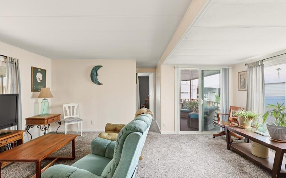 2240 Golden Oak Lane Merced, CA 95340 - Photo 13 of 44 a living room with furniture and a floor to ceiling window