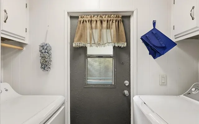 a view of room with furniture and a window