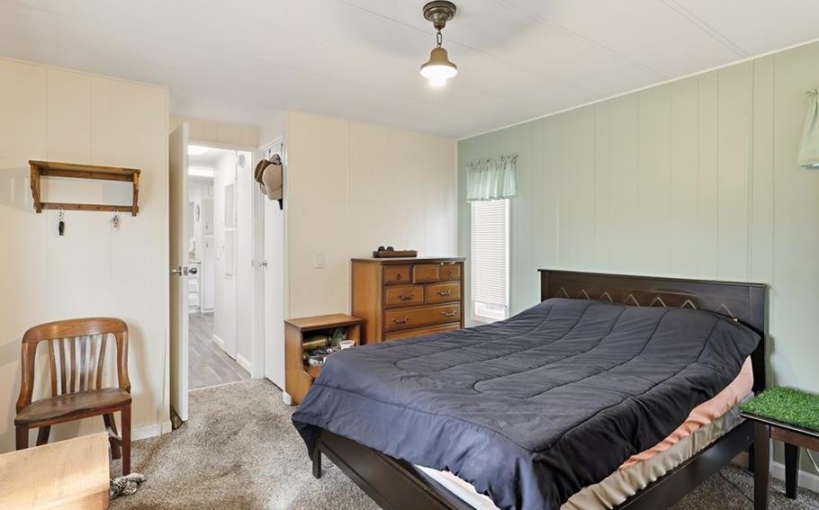 2240 Golden Oak Lane Merced, CA 95340 - Photo 27 of 44 a bed sitting in a bedroom and a chair