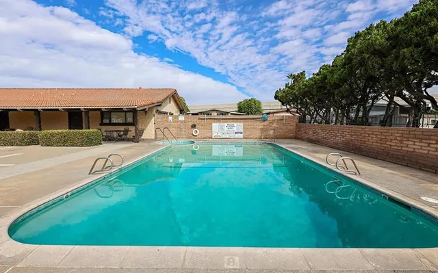 a view of swimming pool with outdoor seating