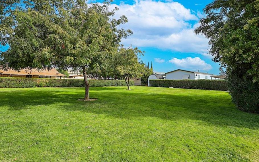 2240 Golden Oak Lane Merced, CA 95340 - Photo 42 of 44 a view of grassy field with benches