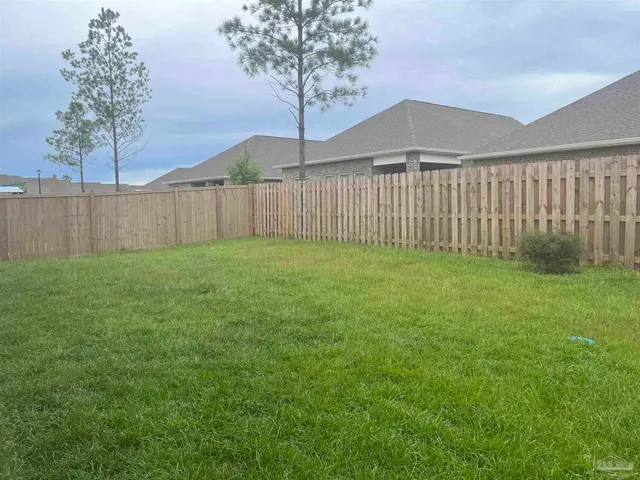 a view of a backyard with a small cabin