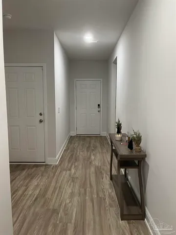 a view of a livingroom with furniture and wooden floor