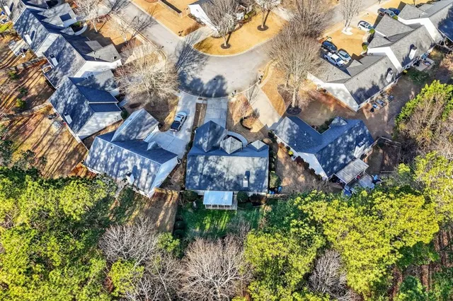 an aerial view of multiple house with a yard