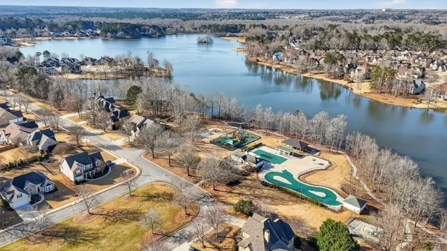 an aerial view of a house with a lake view